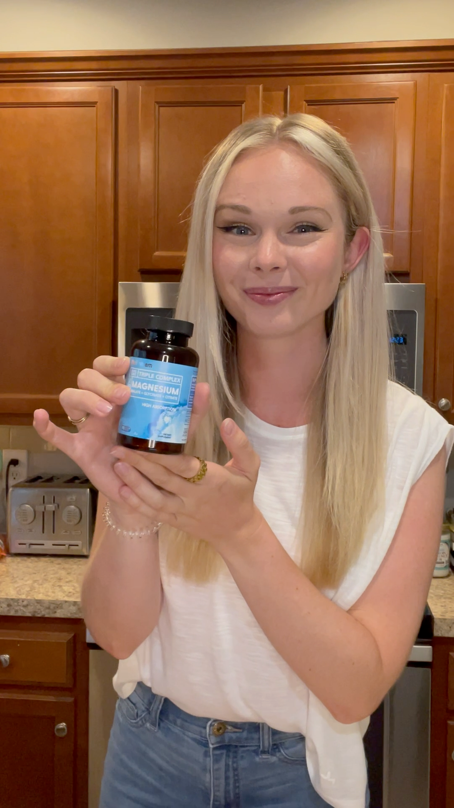 Customer holding a BioEmblem supplement