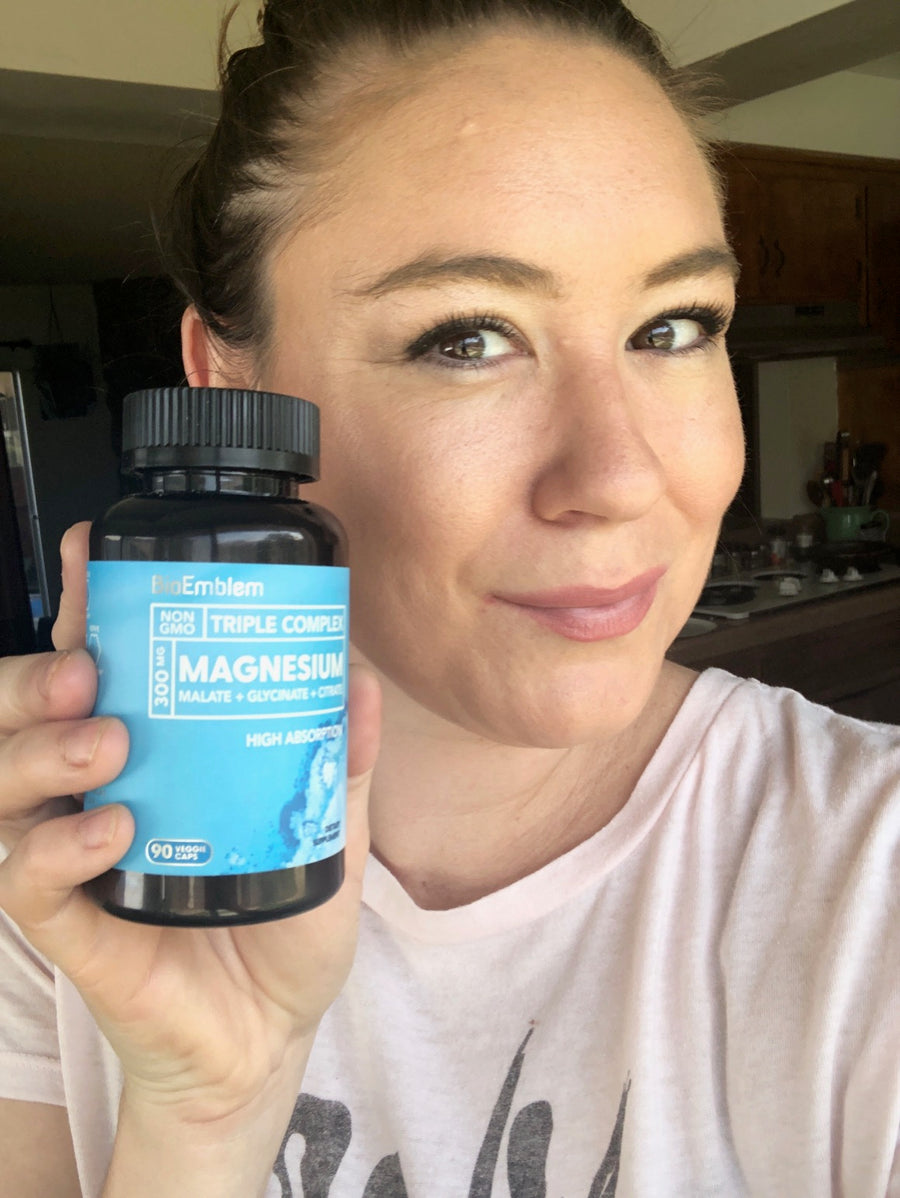 Customer holding a BioEmblem supplement